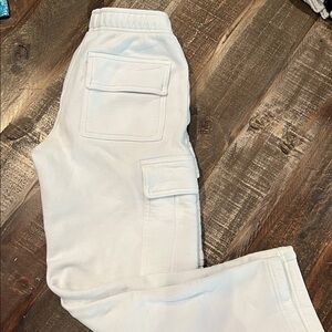 TNA Cozy Fleece Sweatpants in White from ARITZIA